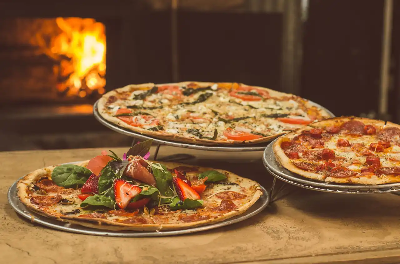 Artisan pizzas with wild mushrooms and herbs