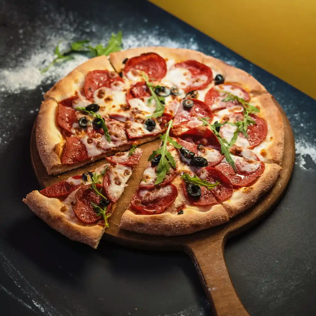 Spicy charred pepper and tomato pizza with rocket