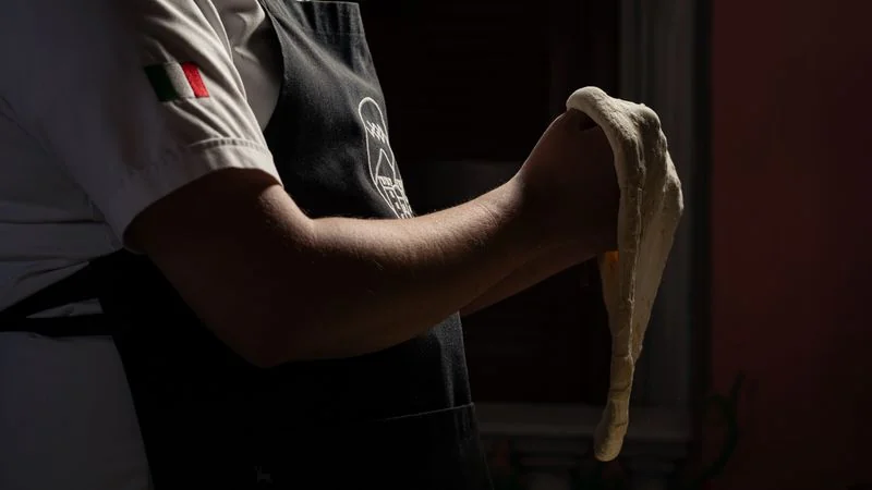 Flour dusting around freshly kneaded dough balls