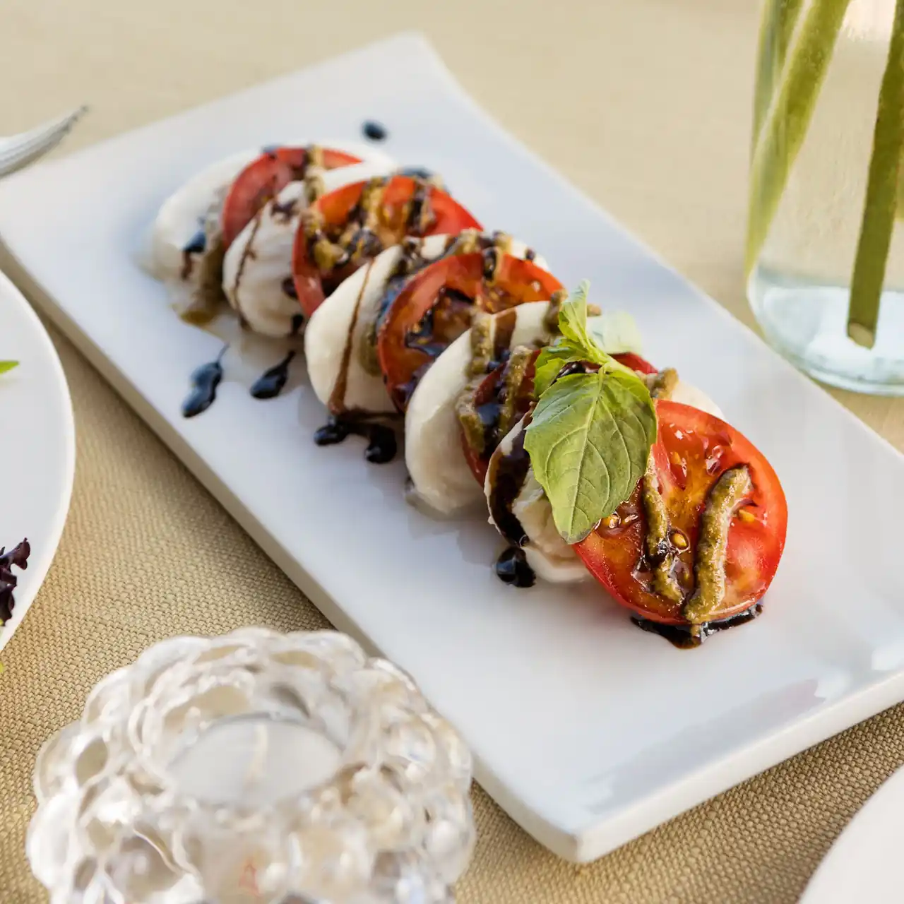 Fresh creamy mozzarella with tomatoes and sweet basil